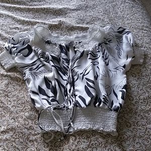 Isabella Rodriguez black and white shirt